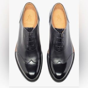 The office of Angela Scott Mr. Evans Black Wingtip size 38.5